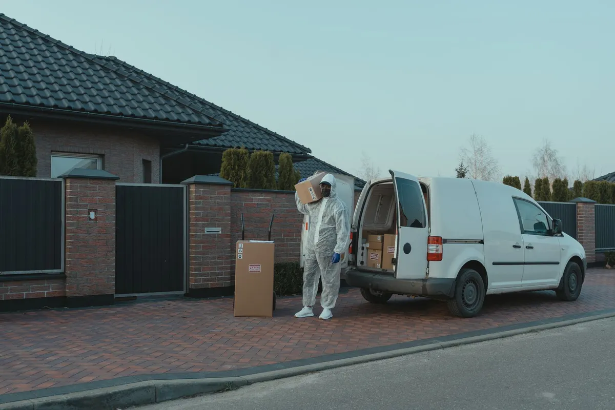 Pest control service vehicle and equipment outside a home