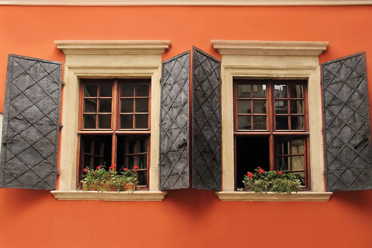 Water-stained wooden window frame on an older house