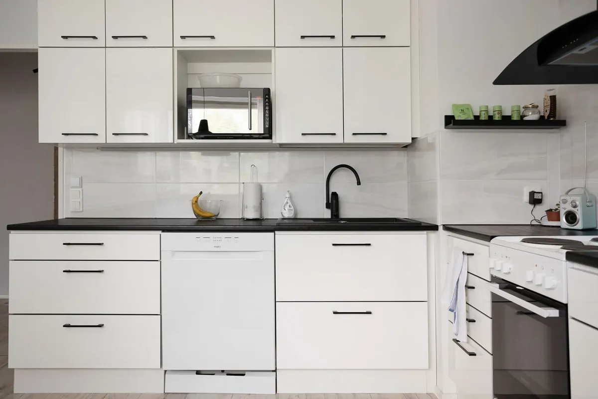 Clean kitchen cabinets and countertop in an older home