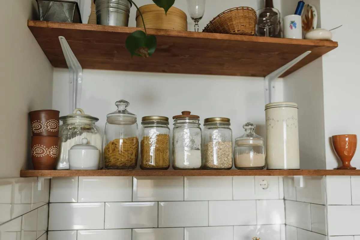 Pantry shelves with food stored in sealed plastic containers