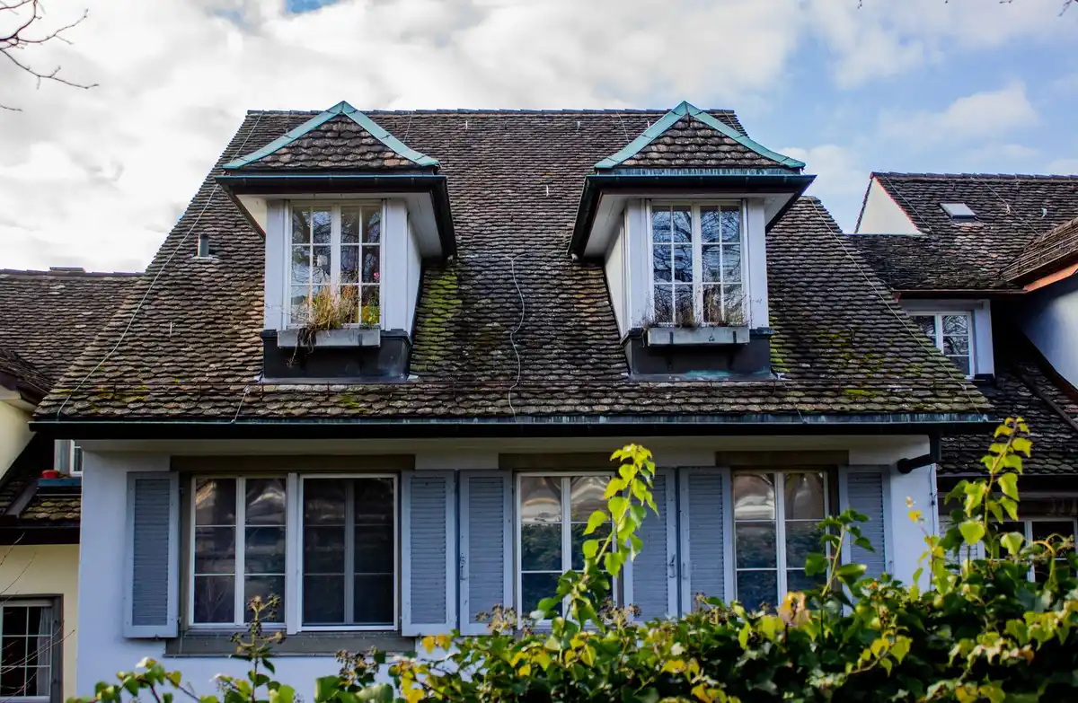 Post-war Cape Cod style house with dormer windows
