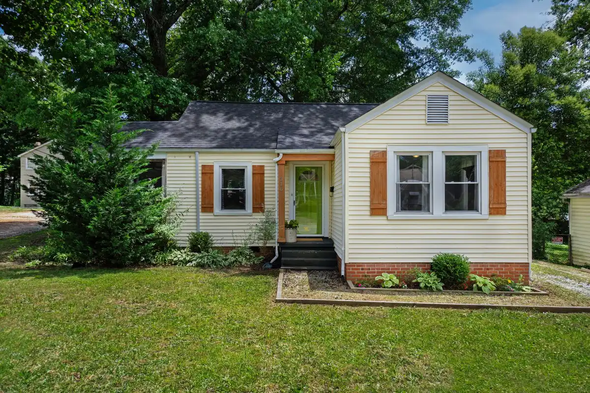 Brick house with a garden bed along the foundation