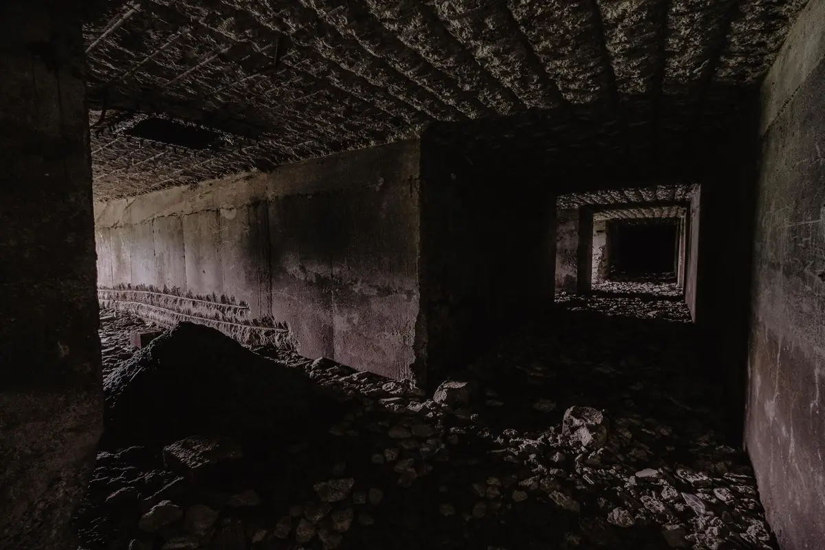 Unfinished basement with block foundation walls and a concrete floor